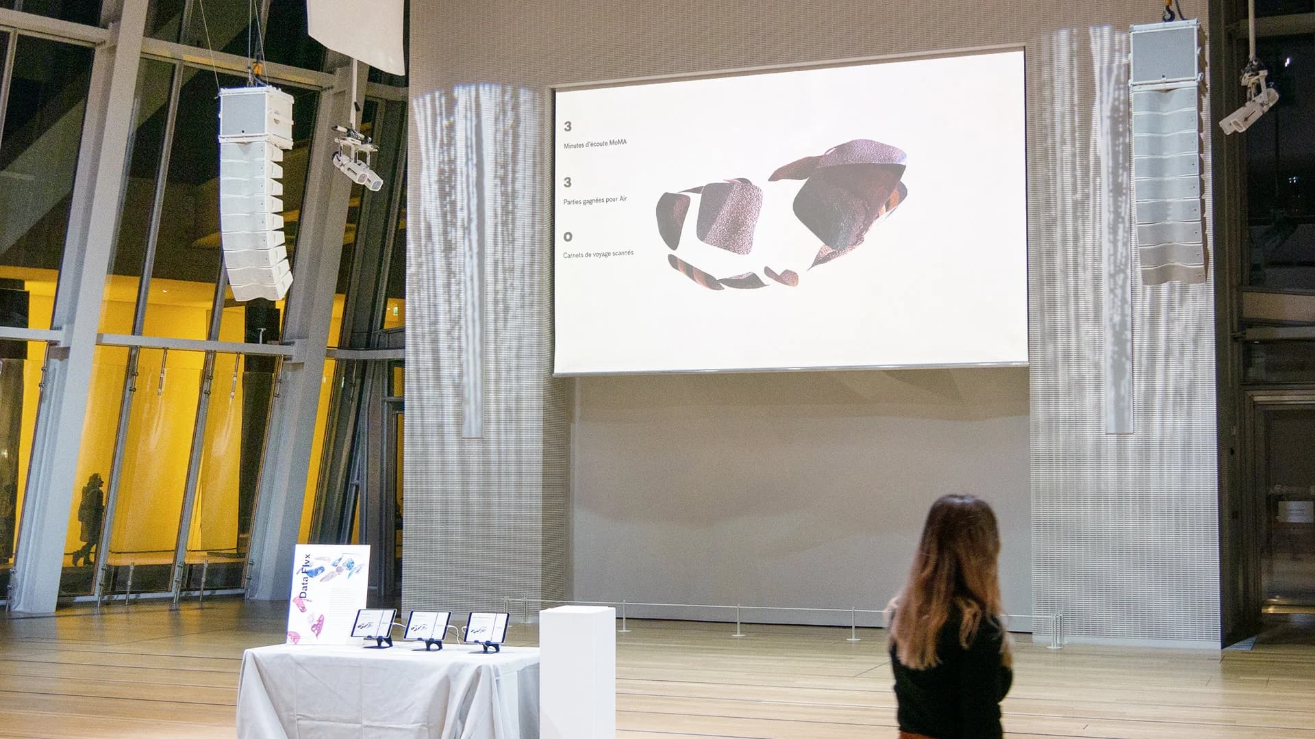Exhibition hall — visitor watching projection